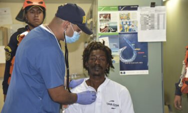 Elvis Francois receives a medical checkup after being rescued in Cartagena