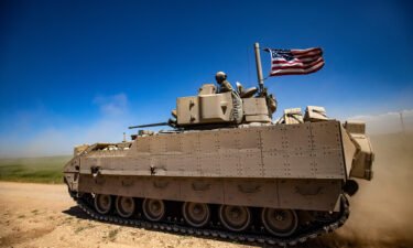 A US Bradley fighting vehicle patrols the countryside of the Kurdish-majority city of Qamishli in Syria's northeastern Hasakeh province In April of 2022. The United States will supply Ukraine with Bradley fighting vehicles as part of a new security assistance package to the country.