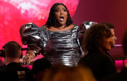 Lizzo reacts after "About Damn Time" won the Grammy for record of the year.