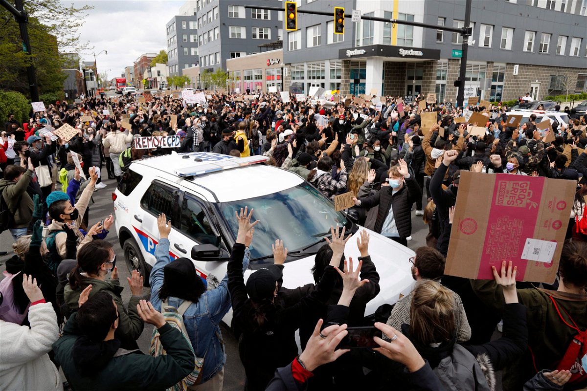 <i>Kyle Robertson/Columbus Dispatch/USA Today Network</i><br/>Ohio State students surround a police vehicle on April 21