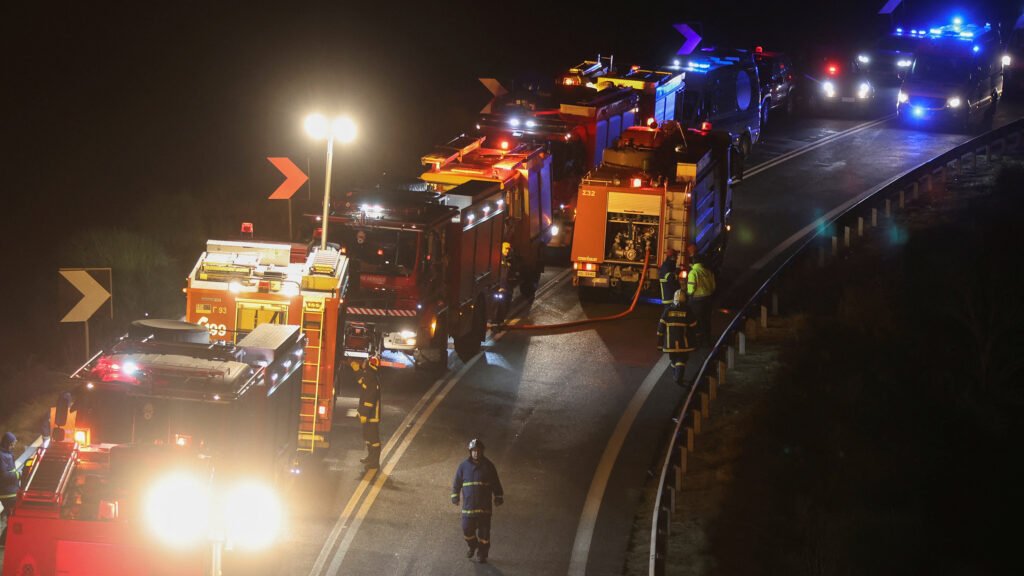 Firefighters and rescuers are seen at the site of a crash, where two trains collided, near the city of Larissa, Greece, March 1, 2023. REUTERS/Thanos Floulis
