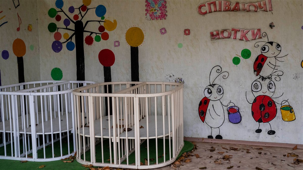 <i>Bernat Armangue/AP</i><br/>The Russian government is operating an expansive network of dozens of camps where it has held thousands of Ukrainian children since the start of the war against Ukraine last year. Empty cribs at Kherson regional children's home in Ukraine are seen here in November of 2022.