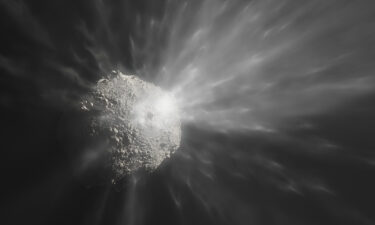 An artist's illustration depicts how the debris cloud likely looked as it was blasted off of the asteroid.