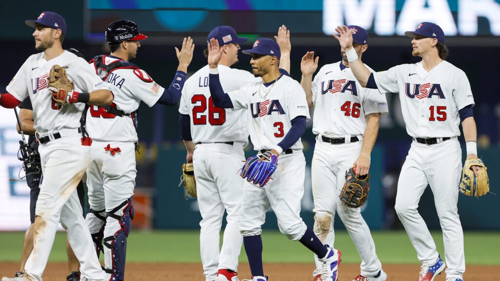 Mar 19, 2023; Miami, Florida, USA; USA right fielder Mookie Betts (3), first baseman Paul Goldschmidt (46), and third baseman Bobby Witt Jr. (15) celebrate with teammates after winning the game against Cuba at LoanDepot Park. Mandatory Credit: Sam Navarro-USA TODAY Sports