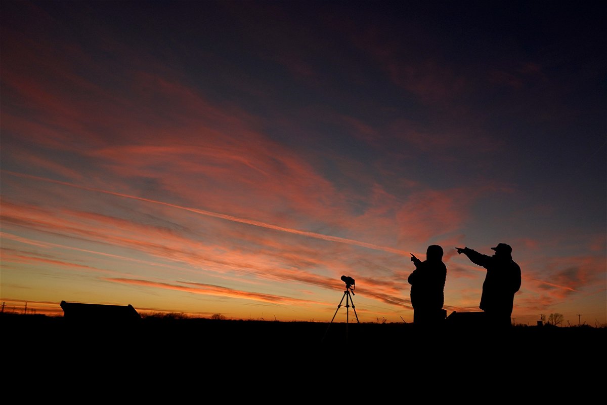 <i>Charlie Riedel/AP</i><br/>People watch the alignment of Saturn and Jupiter in December 2020 in Edgerton