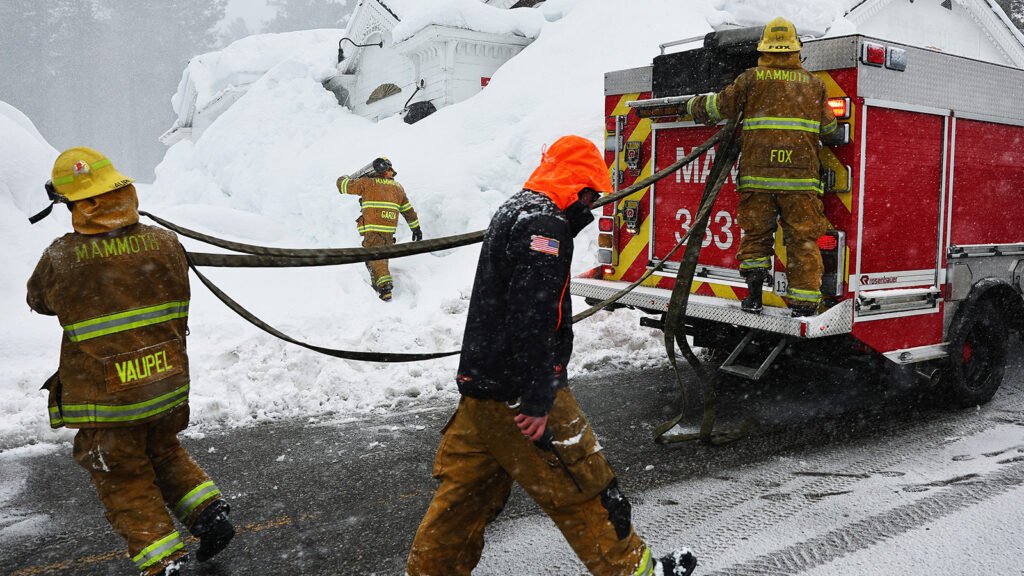 MAMMOTH LAKES, CALIFORNIA - MARCH 12: Mammoth Lakes Fire Department firefighters respond to a propane heater leak and small fire at a shuttered restaurant surrounded by snowbanks on March 12, 2023 in Mammoth Lakes, California. Snowpacks and snow drifts can bear weight on delicate gas lines which can potentially break and create a dangerous pocket of explosive gas. The eastern Sierra Nevada mountains currently hold 243 percent of its regular snowpack for this time of the year. California is bracing for another powerful atmospheric river event, bringing more snow to higher elevations and rain to lower elevations, beginning tomorrow.  (Photo by Mario Tama/Getty Images)