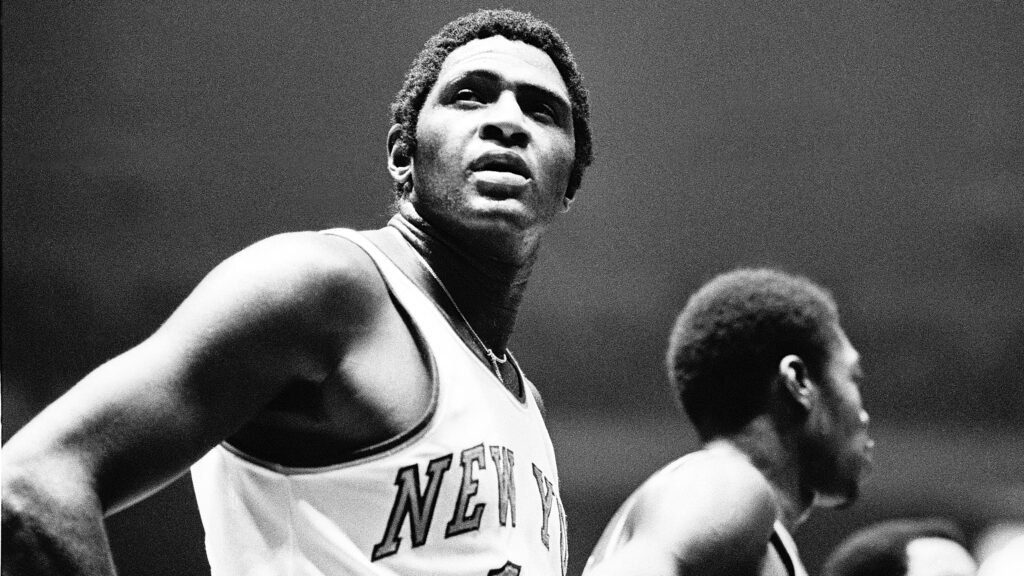 NEW YORK, NY - OCTOBER 16, 1973:  Willis Reed, center of the New York Knicks, takes a brief pause to look at the scoreboard during an NBA basketball game against the Buffalo Braves in Madison Square Garden on October 16, 1973 in New York. Reed scored 6 points during the game as the New York Knicks defeated the Buffalo Braves, 117-91. (Photo by Ross Lewis/Getty Images)