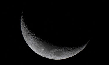 The waxing crescent moon is seen from Panama City on March 25.