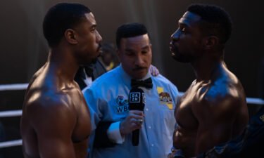 Director-star Michael B. Jordan (left) squares off with Jonathan Majors (right) in "Creed III."