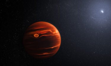 An illustration of exoplanet VHS 1256 b and its two stars.