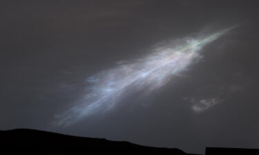 The Curiosity rover just sent back a stunning postcard capturing its view of a shimmering sunset on Mars. The rover captured this feather-shaped iridescent cloud just after sunset on January 27.