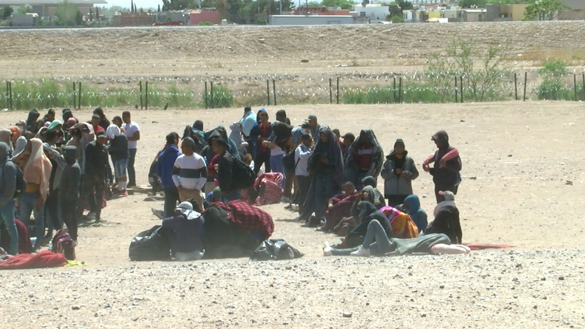 A group of migrants waiting to be transported by Border Patrol agents