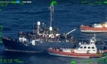 Rescue operations are underway to retrieve hundreds of migrants adrift on a boat in the Mediterranean Sea