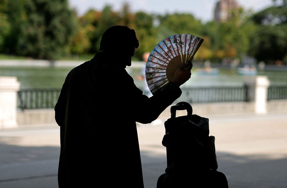 <i>Thomas Coex/AFP/Getty Images</i><br/>A man uses a hand fan in a park in central Madrid during a heatwave