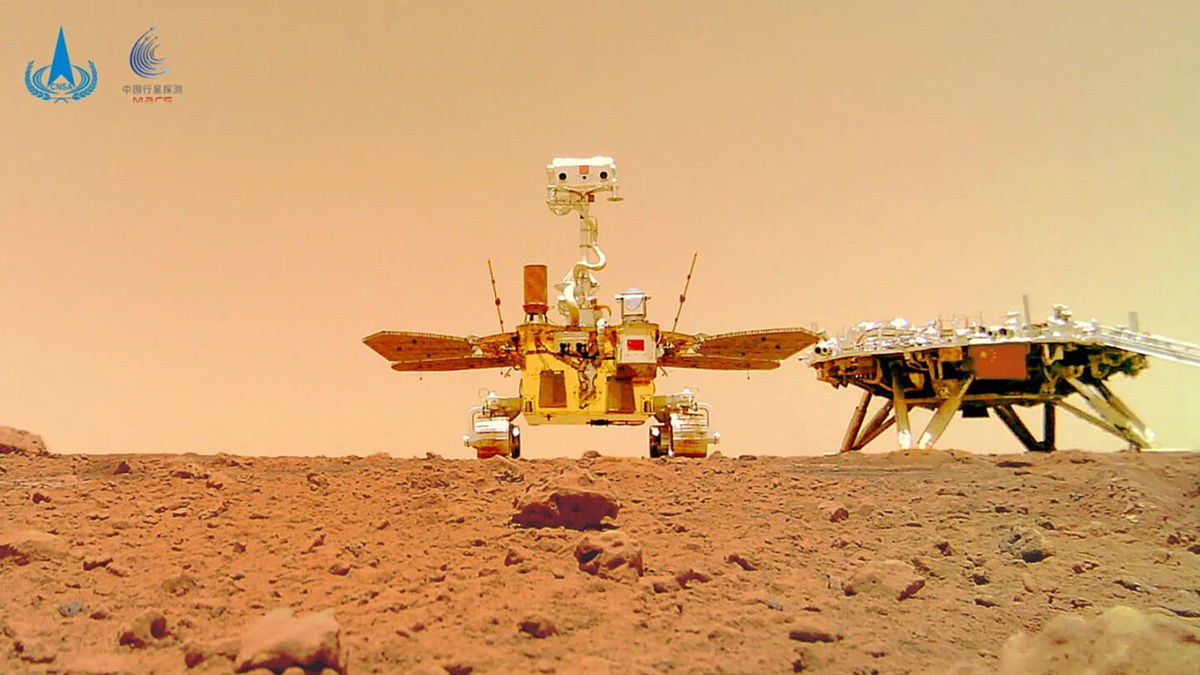 <i>CNSA</i><br/>This image showing the rover and the lander on the surface of Mars was taken by a separable camera deployed by the Zhurong rover in 2021.