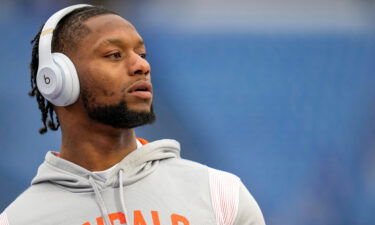 Joe Mixon throws passes with fans during warmups before the NFL divisional playoff football game on January 22.