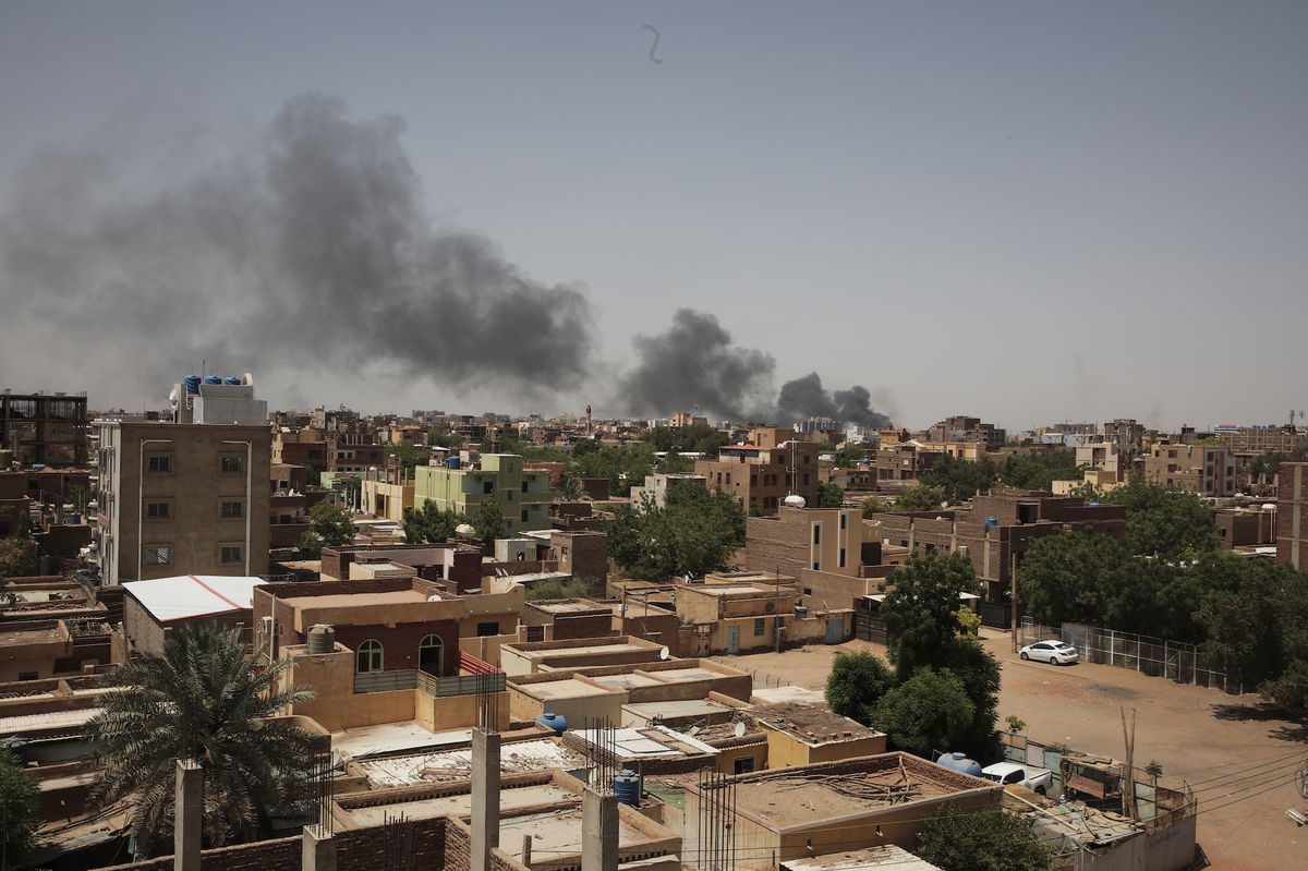 <i>Marwan Ali/AP</i><br/>Smoke is seen in Sudan's capital Khartoum on Saturday