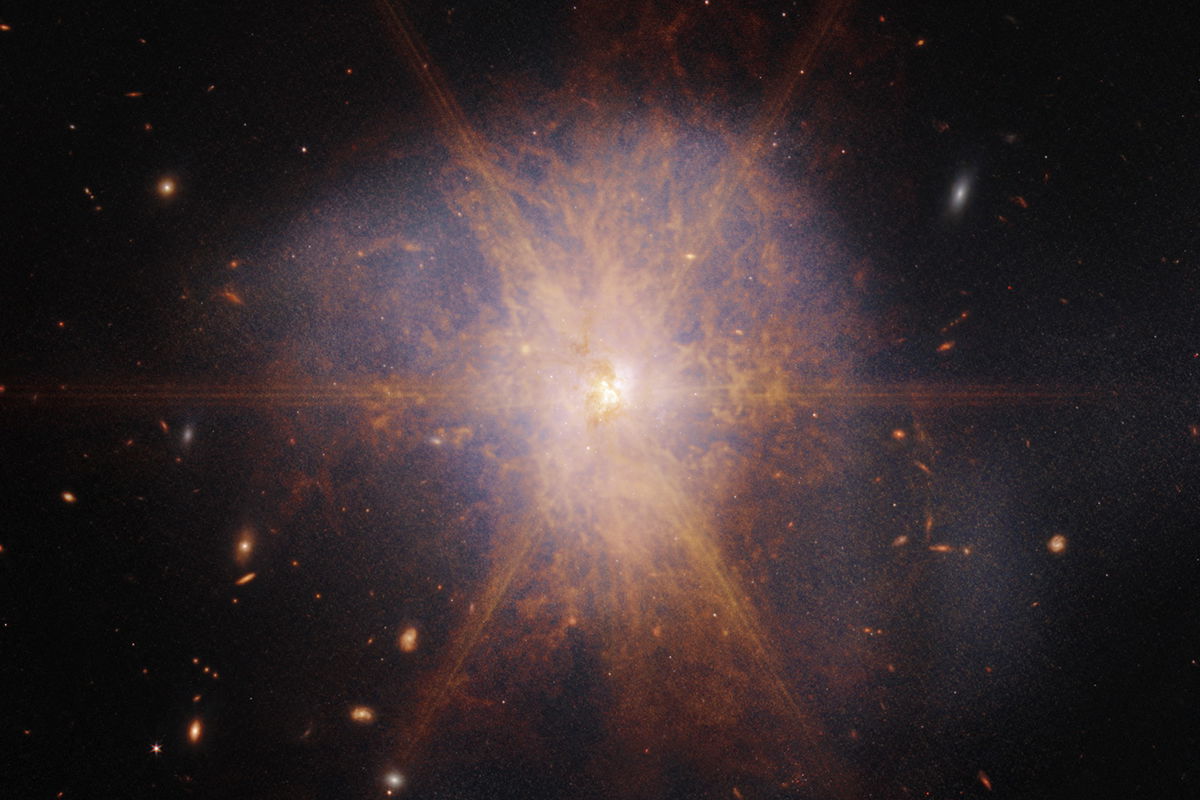 <i>NASA/ESA/CSA/STScI</i><br/>Shining like a brilliant beacon amidst a sea of galaxies