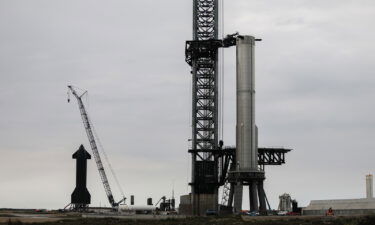 SpaceX workers on February 8 make final adjustments to Starship's orbital launch mount