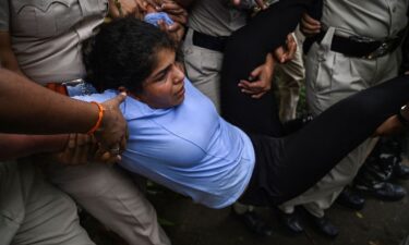 Indian wrestler Sakshi Malik is detained by the police while attempting to march to India's new parliament in New Delhi on May 28