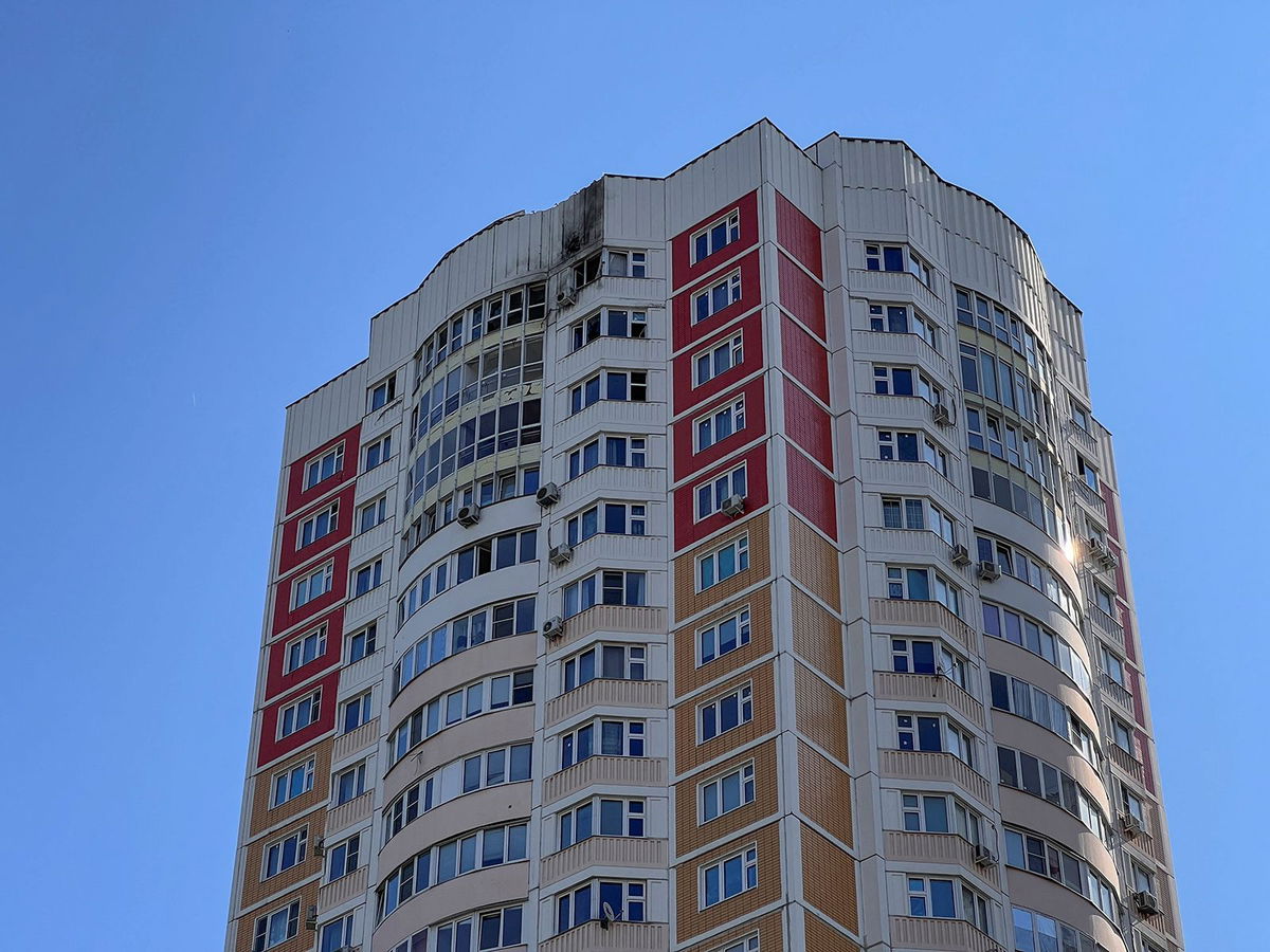 <i>Lev Sergeev/Reuters</i><br/>A view shows a damaged multi-story apartment block following a reported drone attack in Moscow