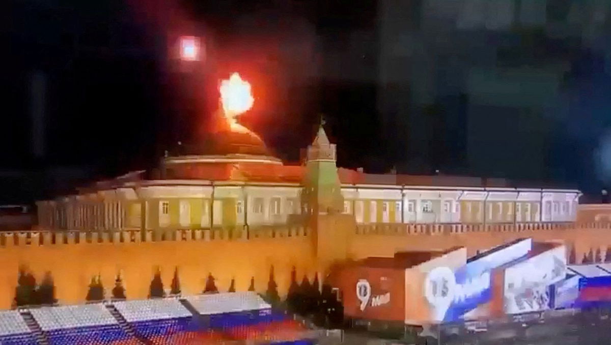 <i>Ostorozhno Novosti/Reuters</i><br/>A still image shows a flying object exploding in an intense burst of light near the dome of the Kremlin Senate building earlier this month.