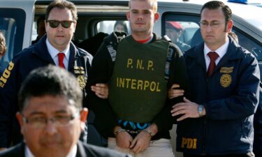 Chilean police officers escort Joran Van der Sloot to a police station in June 2010.