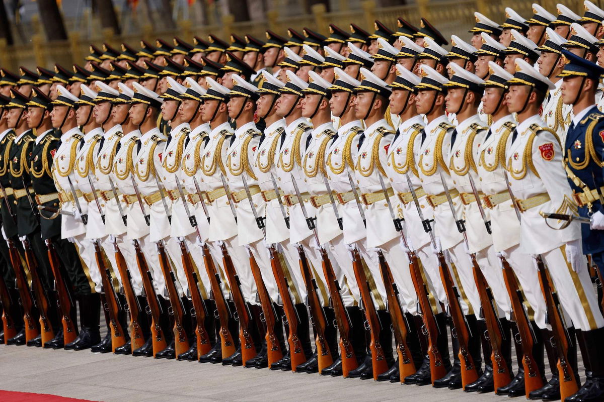 <i>Ludovic Main/AFP/Getty Images/FILE</i><br/>A joke by a Chinese stand-up comedian that loosely referenced a slogan used to describe the country’s military has cost an entertainment firm more than $2 million. Pictured are People's Liberation Army soldiers in Beijing on April 6.