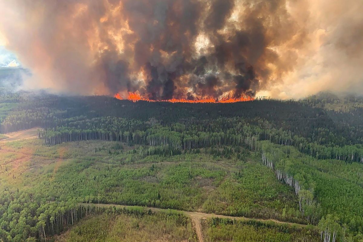 <i>Government of Alberta Fire Service/Canadian Press/AP</i><br/>The Bald Mountain Wildfire burns in the Grande Prairie Forest Area in Alberta on Friday