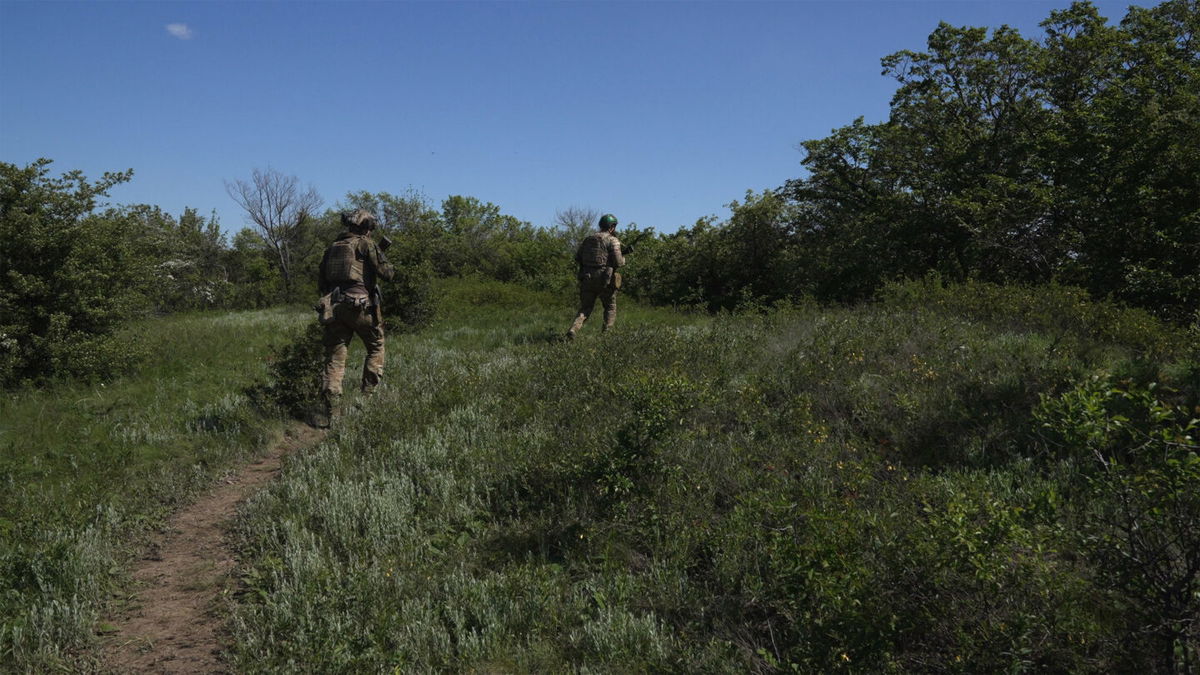 <i>David von Blohn/CNN</i><br/>Ukrainian soldiers use the forest foliage as cover from Russian attacks on the outskirts of Bahkmut.