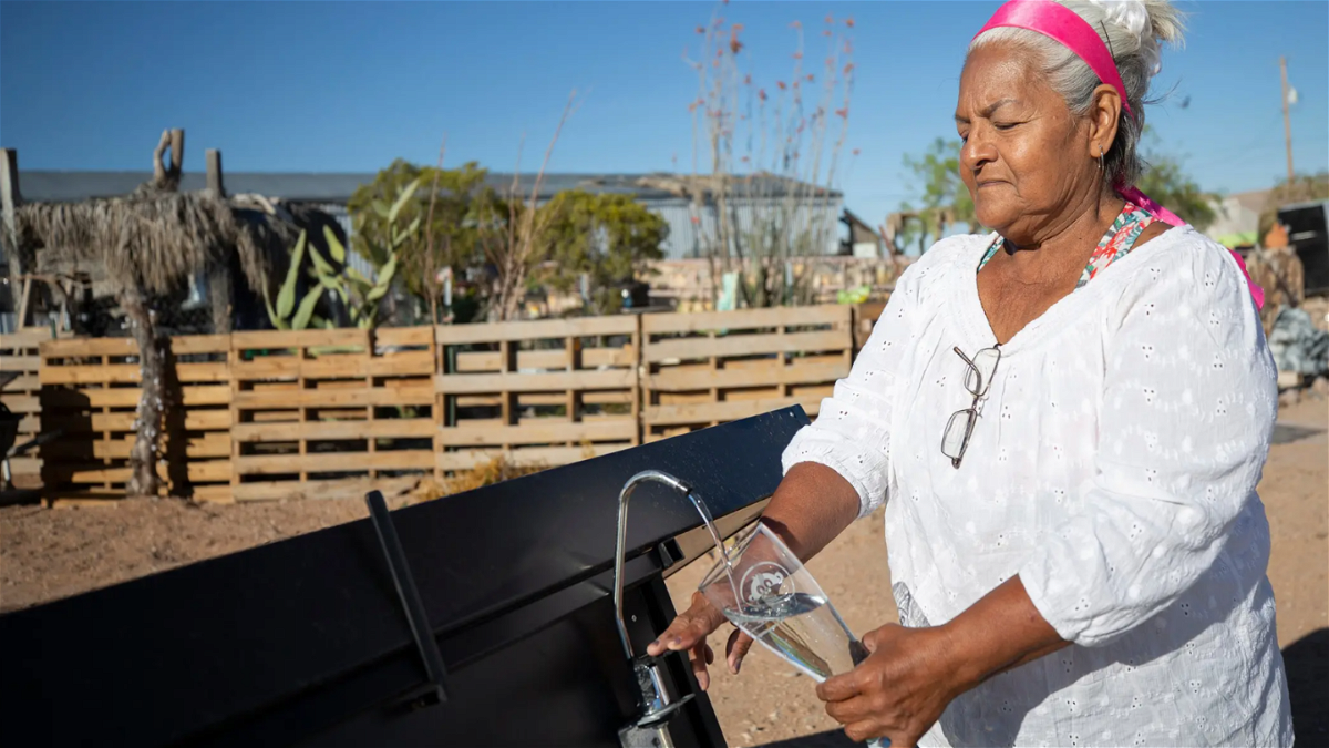 Olga Thomas and other residents of Hueco Tanks rely on a private company to haul water to their neighborhood. Now she can count on her hydro panels for drinking water.