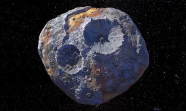 This rendering shows how scientists think the Psyche asteroid appears up close.