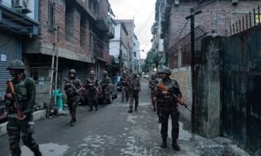 Indian army soldiers patrol the streets of Manipur on June 7.