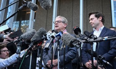 Journalists Chris Masters (left) and Nick McKenzie (right) talk to the media outside the Federal Court of Australia in Sydney on June 1.