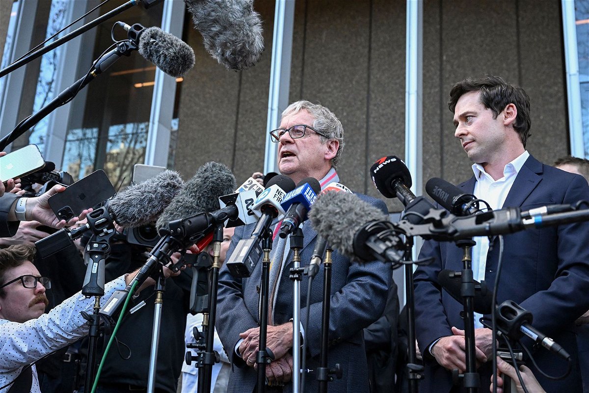 <i>Saeed Khan/AFP/Getty Images</i><br/>Journalists Chris Masters (left) and Nick McKenzie (right) talk to the media outside the Federal Court of Australia in Sydney on June 1.