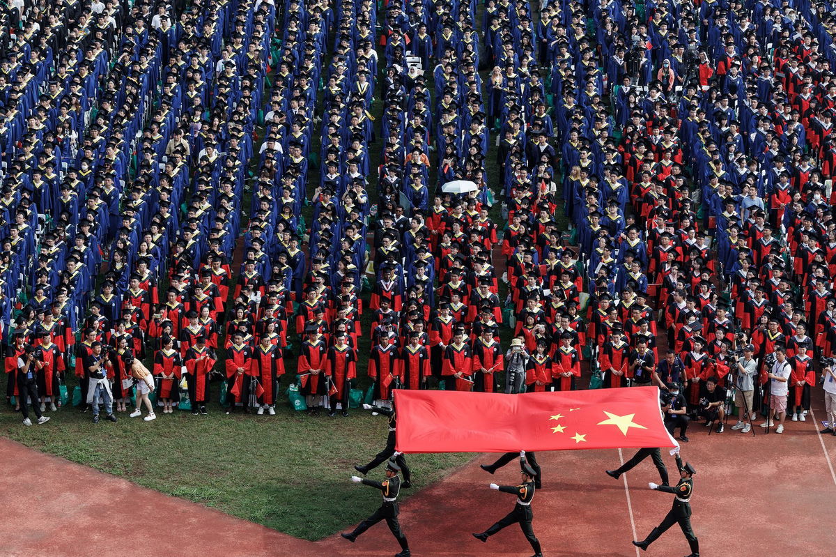 <i>Ren Yong/SOPA Images/LightRocket/Getty Images</i><br/>Students at Wuhan University