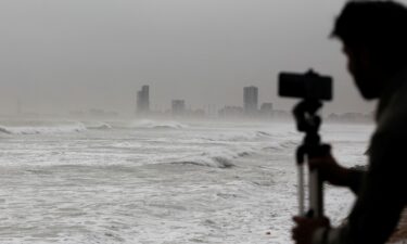 A man films the sea