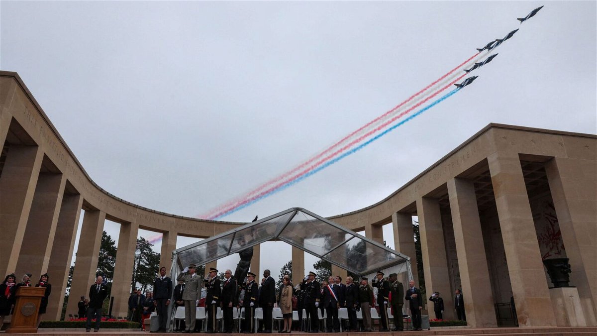 A French elite acrobatic flying team flies over during a ceremony at the Normandy American Cemetery and Memorial as part of the 79th anniversary of the World War II D-Day Normandy landings in Colleville-sur-Mer, Normandy, on June 6.