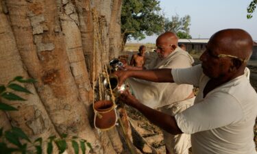 Relatives perform the last rites of three villagers who died due to heat-related ailments in Ballia district