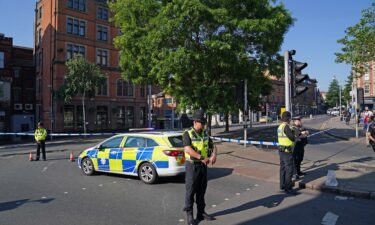 Police officers line a street in Nottingham on Tuesday