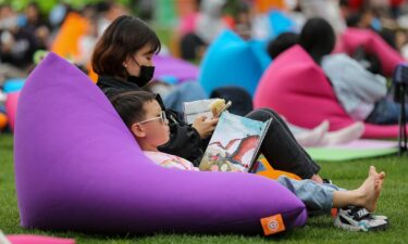 A child reads a book at Seoul Plaza in Seoul