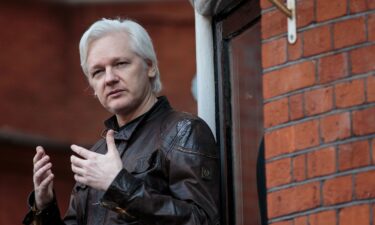 Julian Assange speaks to the media from the balcony of the Embassy Of Ecuador on May 19