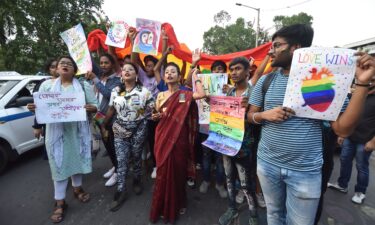 The LGBTQ community takes part in a rally to celebrate "Love