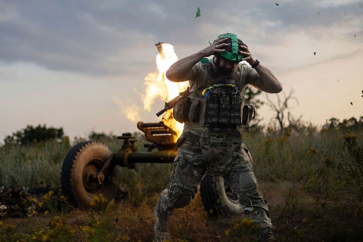 <i>Alex Babenko/AP</i><br/>A Ukrainian serviceman of the 3rd Assault Brigade fires a 122mm mortar towards Russian positions at the front line