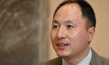 Chinese scientist He Jiankui reads a statement to the media at a hotel in Beijing on February 21.