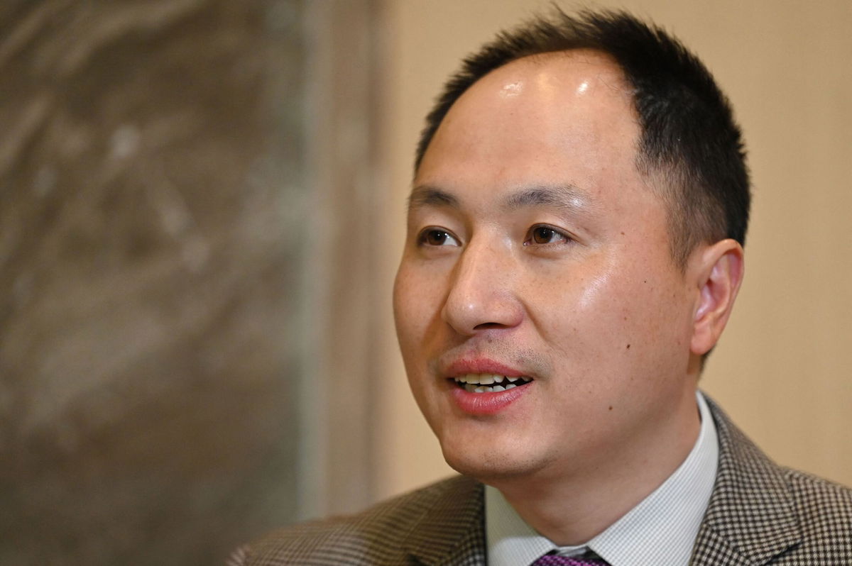 <i>Greg Baker/AFP/Getty Images</i><br/>Chinese scientist He Jiankui reads a statement to the media at a hotel in Beijing on February 21.