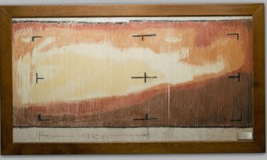 The hand-colored version of the Mariner 4 image is part of an exhibit at NASA's Jet Propulsion Laboratory in Pasadena