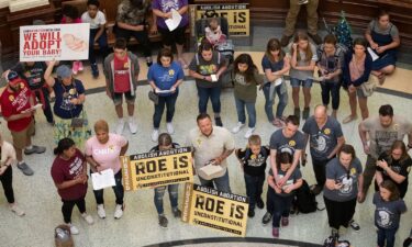 Anti-abortion demonstrators gather in the rotunda at the Capitol in Austin