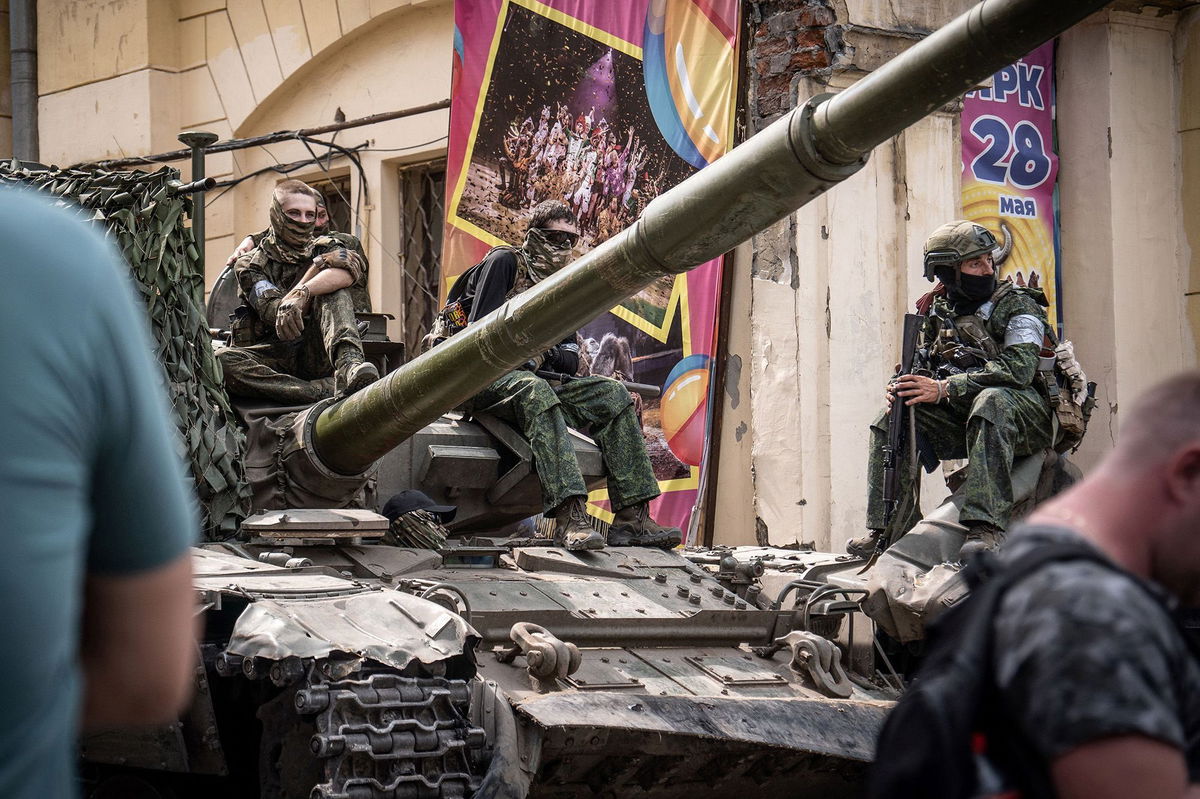 <i>Roman Romokhov/AFP/Getty Images</i><br/>Members of Wagner group sit atop of a tank in a street in the city of Rostov-on-Don