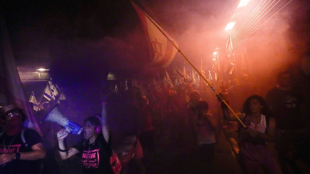 <i>Ariel Schalit/AP</i><br/>Israelis protest against plans to overhaul the judicial system in Tel Aviv